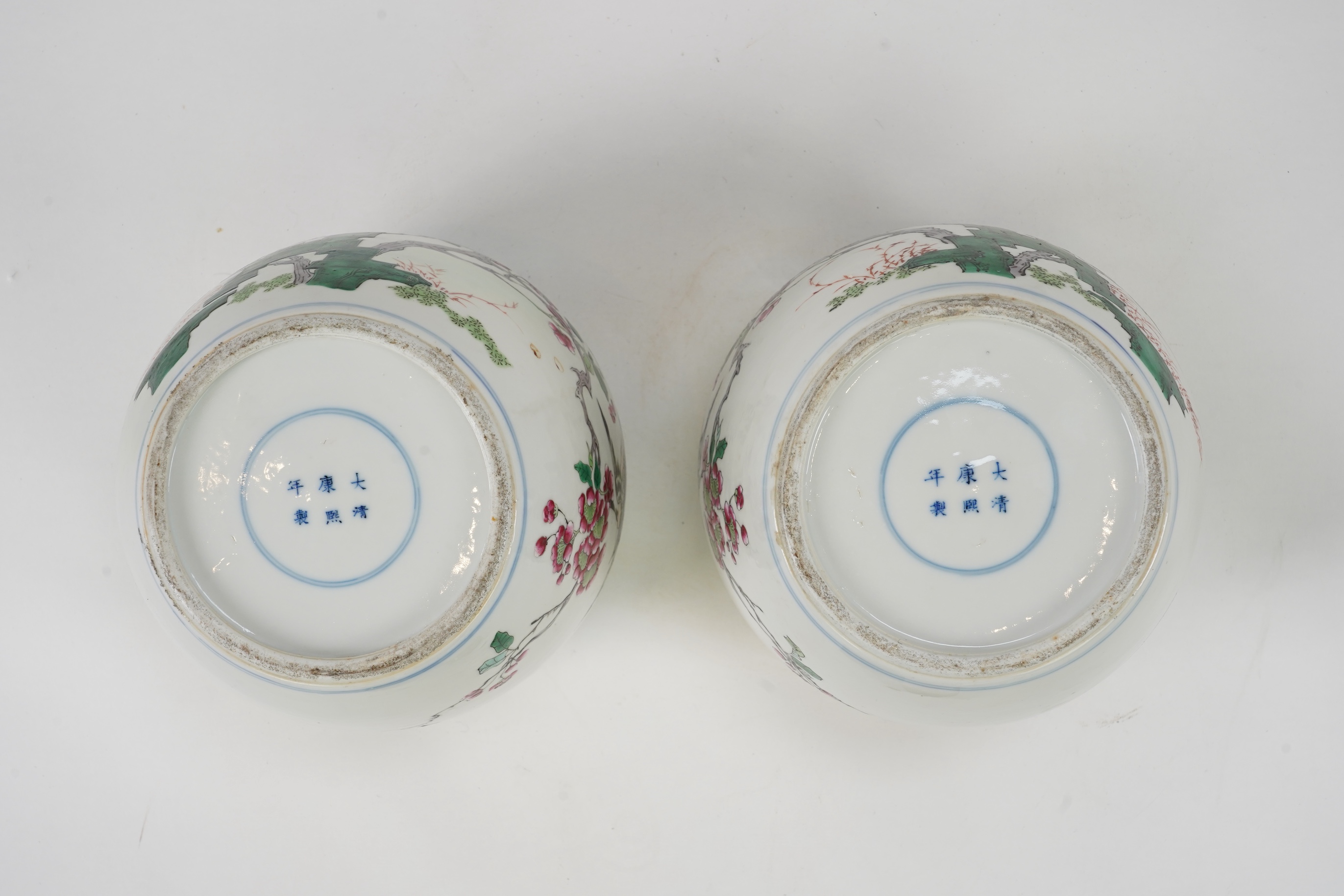 A pair of Chinese famille rose jars and covers, Kangxi mark but late 19th/early 20th century
